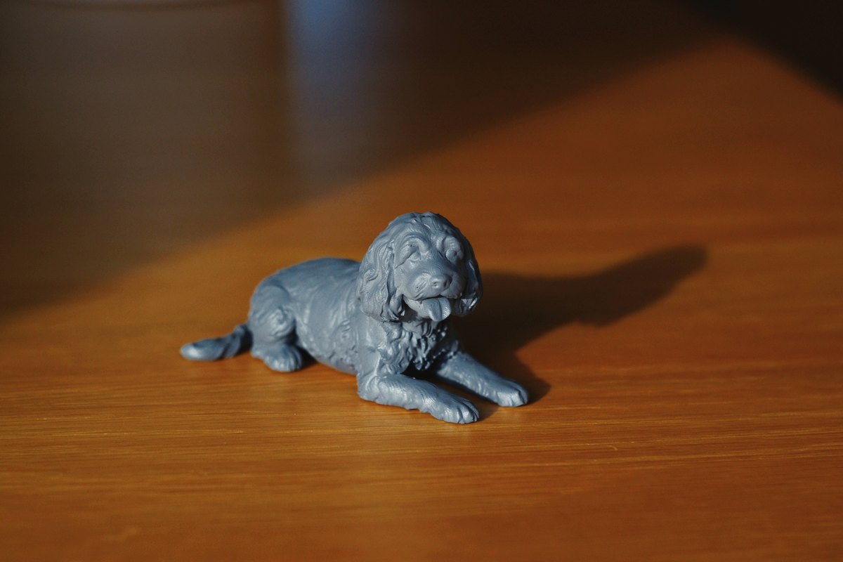 Grey primed resin pet figurine close-up