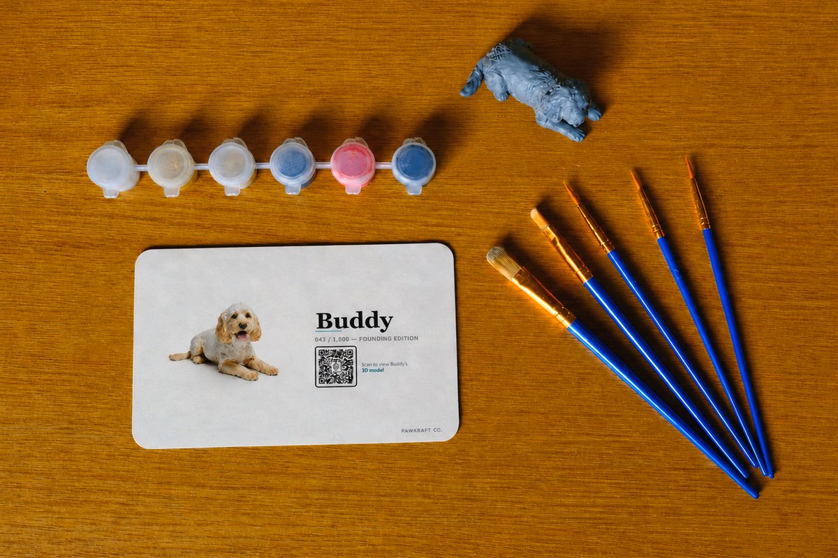 Pawkraft kit contents with paint pots, brushes and reference card